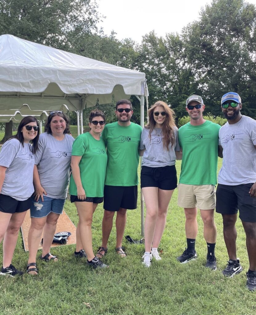 Ellie, third from right, with a few of the friends she has made while volunteering in her community.