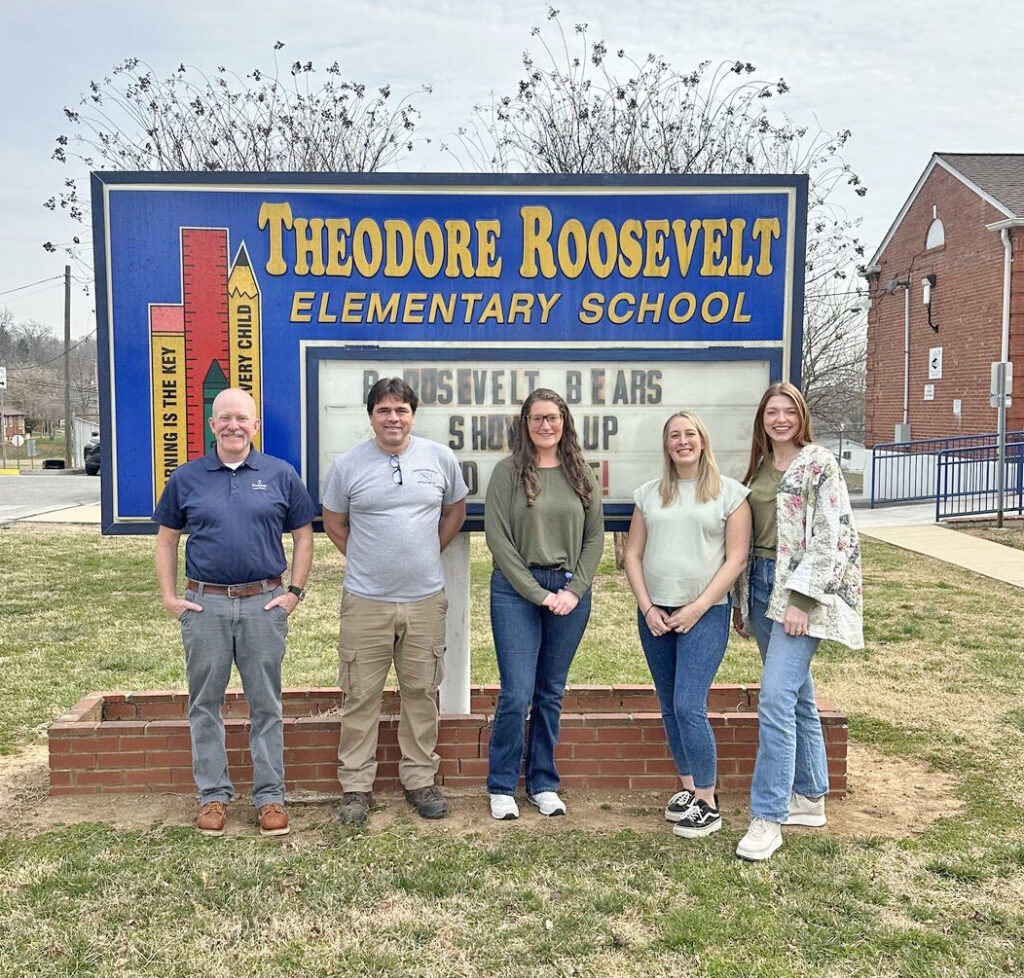 Reading to Roosevelt Elementary students during Read Across America Week were Domtar employees, from left, Dan Wernick, senior business analyst for wood procurement; Mark Fuller, IT administrator; Jessica Thompson, training and development leader; Tori Gilliam, senior CI specialist; and Ellie Mitchell, HR generalist.