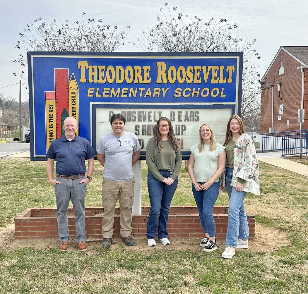 Reading to Roosevelt Elementary students during Read Across America Week were Domtar employees, from left, Dan Wernick, senior business analyst for wood procurement; Mark Fuller, IT administrator; Jessica Thompson, training and development leader; Tori Gilliam, senior CI specialist; and Ellie Mitchell, HR generalist.