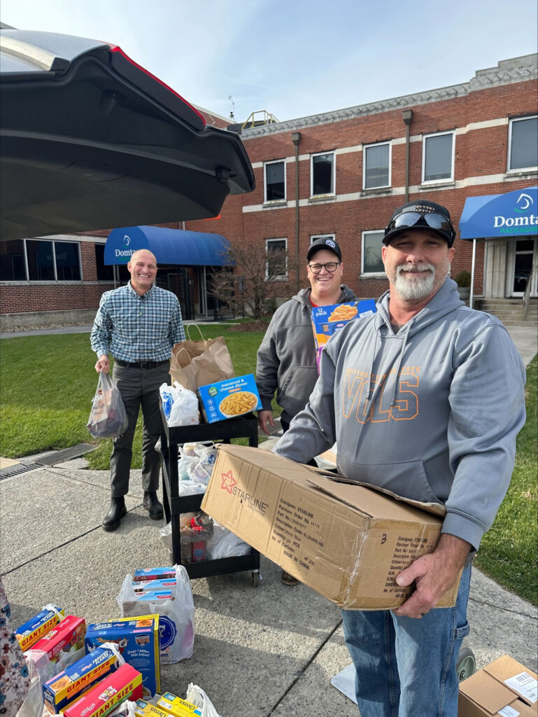 Members of the Domtar Kingsport and United Steelworkers Local 12943 team load donated items for distribution to local families through the Kingsport City Schools’ Family Resource Center.