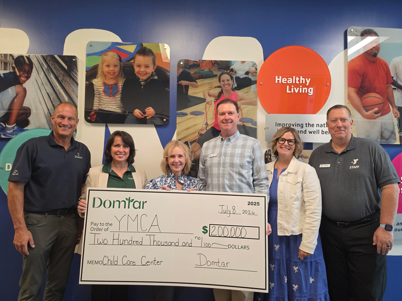 Domtar representatives present a $200,000 donation to the Greater Kingsport Family YMCA for its new childcare center.