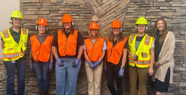 Women in Manufacturing Tennessee visitors and Domtar employees gather in safety gear during a Kingsport Mill tour.