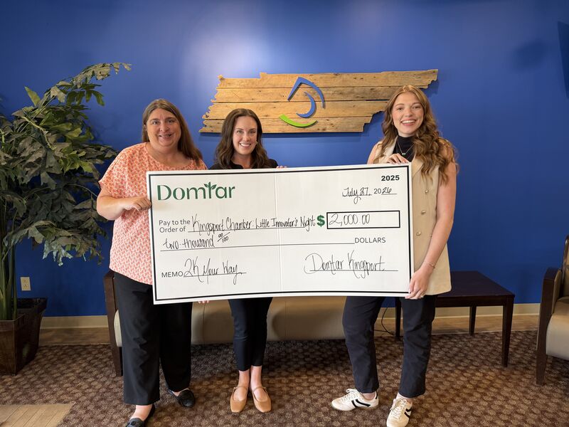Vanessa Bennett, Madison Greene and Ellie Mitchell hold a $2,000 Domtar $2K Your Way check for the Kingsport Chamber's Little Innovators' Night.